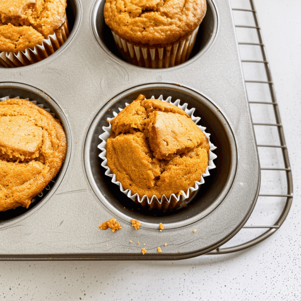 Pumpkin Protein Muffins With Greek Yogurt: Your New Favorite Snack 9 Pumpkin protein muffins with Greek yogurt fresh from oven in muffin tin