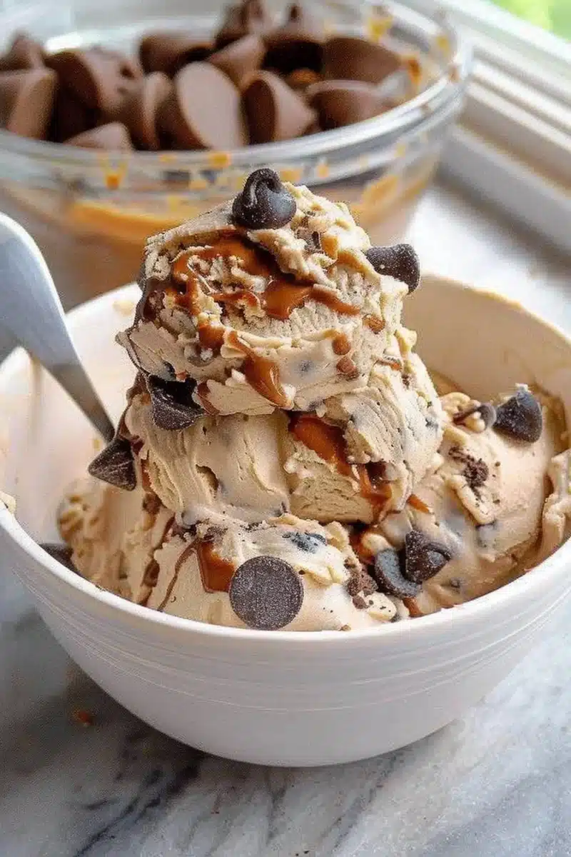 Fluffy protein whipped cookie dough in a bowl, ready to eat.