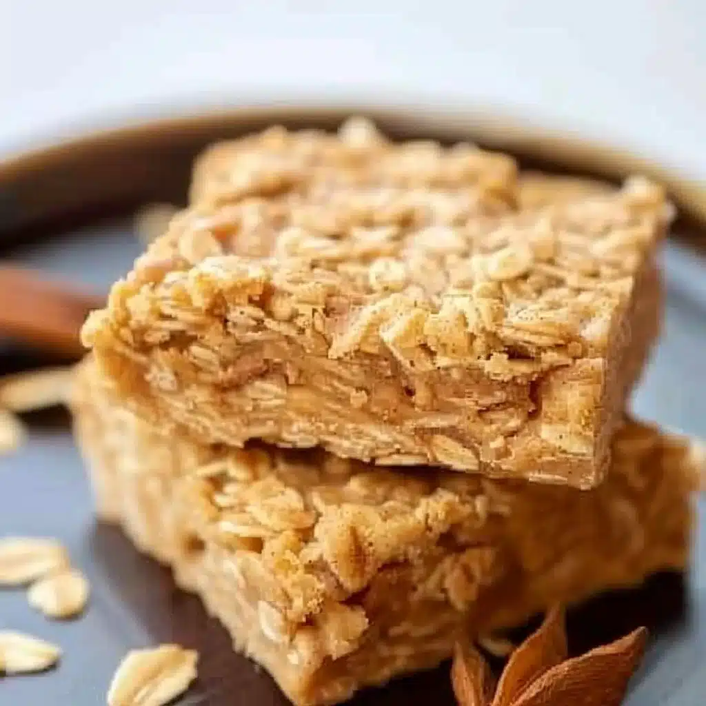Homemade cinnamon apple oatmeal bars on a wooden table