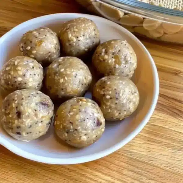 No-Bake Protein Energy Balls 9 Homemade no-bake protein energy balls in a bowl with ingredients